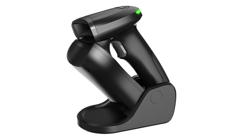 Handheld skener barkoda on a table.